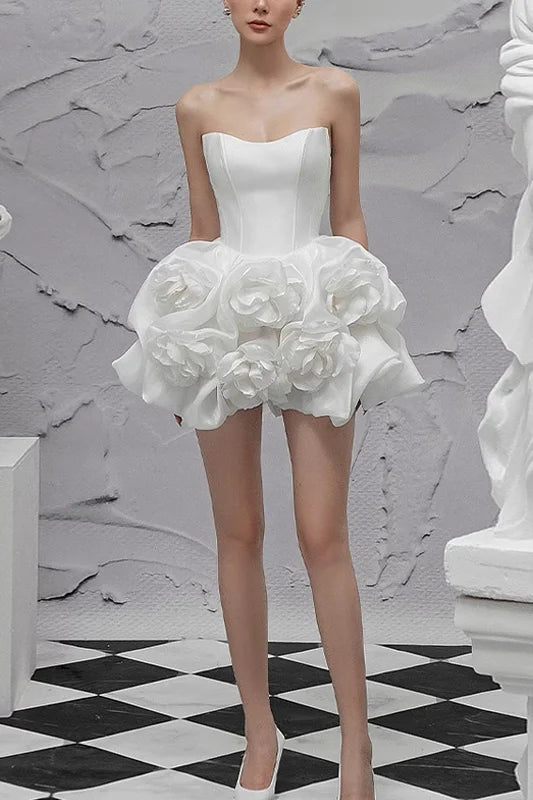 Elegant white evening gown with three-dimensional flowers