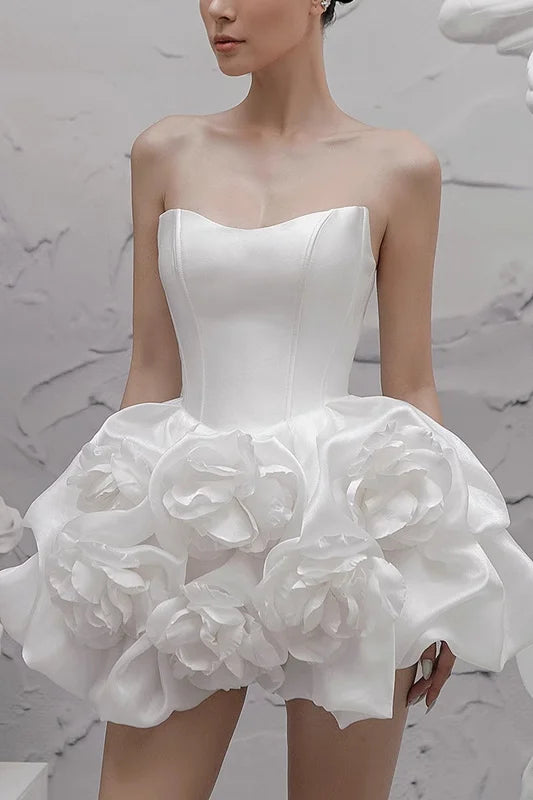 Elegant white evening gown with three-dimensional flowers