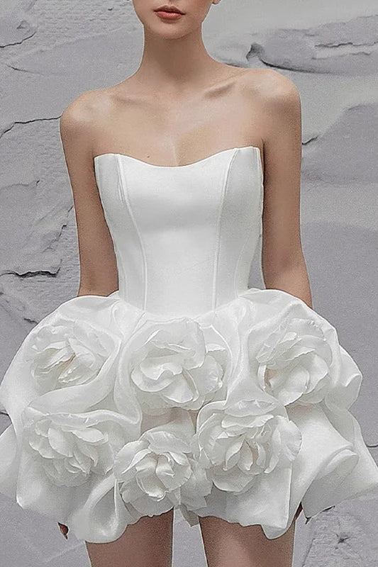 Elegant white evening gown with three-dimensional flowers