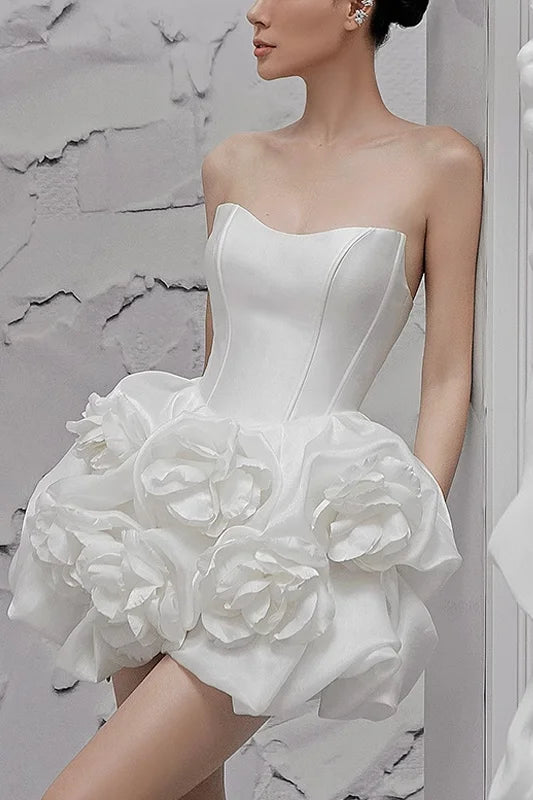 Elegant white evening gown with three-dimensional flowers