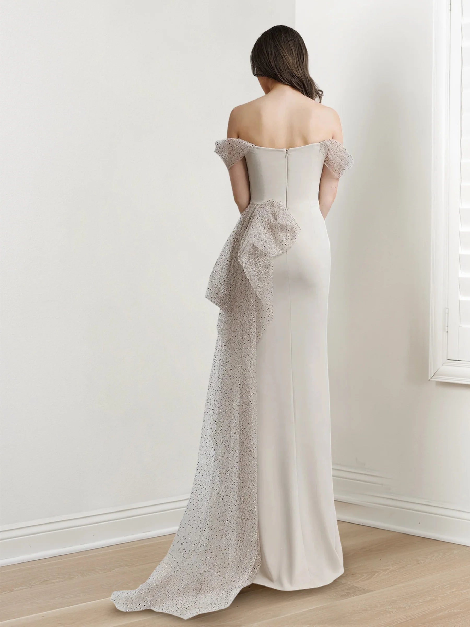 Minimally designed long off shoulder short sleeved floor standing evening gown