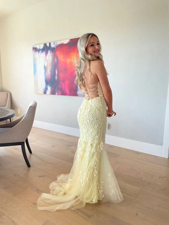 Elegant backless lace ball gown with thin shoulder straps