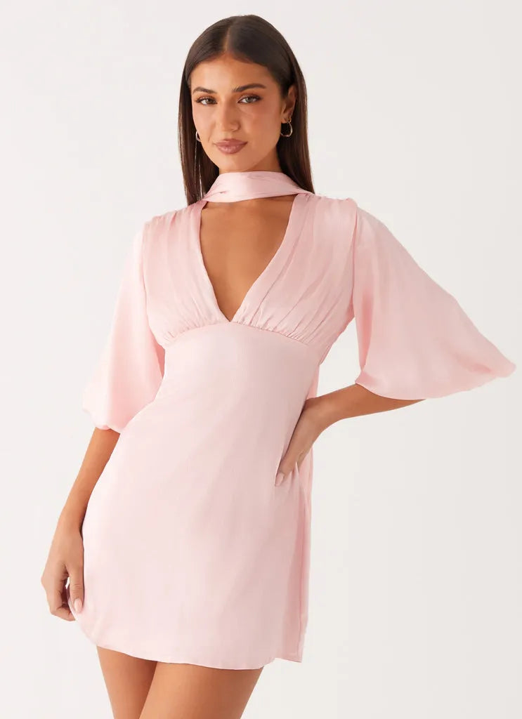 Blush Pink Satin Homecoming Dress with Halter Neckline Deep V Cut Bell Sleeves and Tie - Back Detail