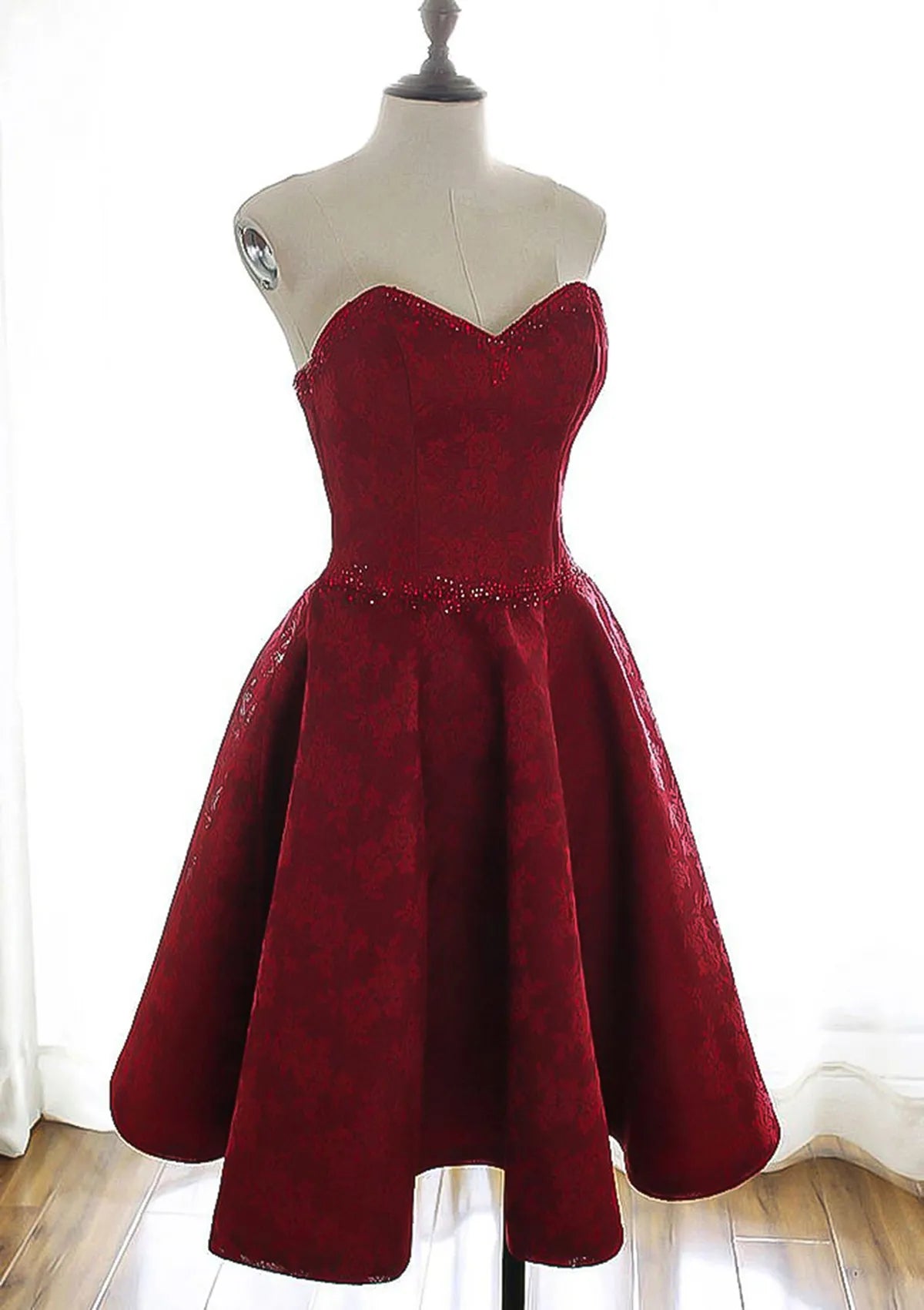 Burgundy Brocade Homecoming Dress with Strapless Sweetheart Neckline Embellished Waist and Flared Skirt Timeless Elegance for Memorable School Events