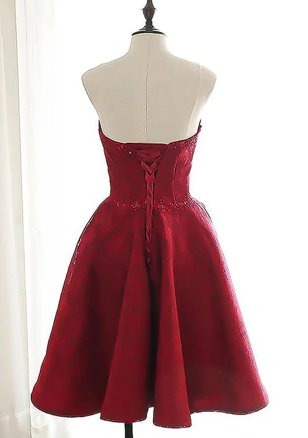 Burgundy Brocade Homecoming Dress with Strapless Sweetheart Neckline Embellished Waist and Flared Skirt Timeless Elegance for Memorable School Events