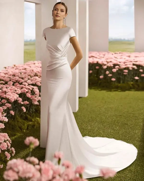 Charming Mermaid Boat Neck Cap Sleeve Button-Back Sweep/Brush Train Wedding Dresses with draped bodice.