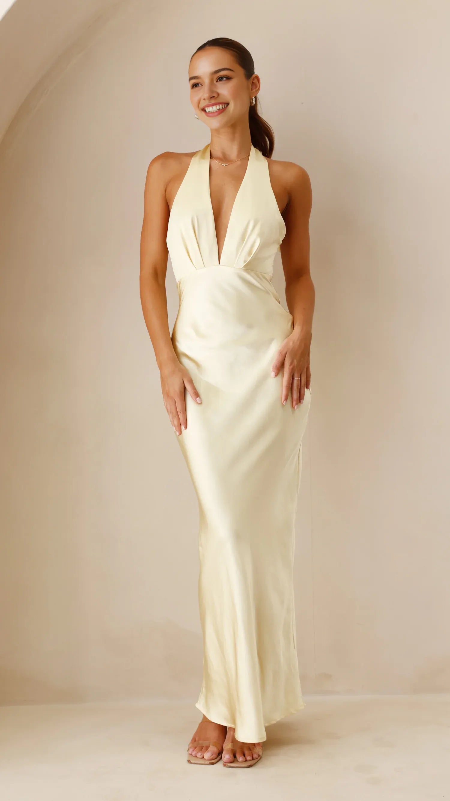 Cream Halter Neck Satin Prom Dress with Deep V - neck Ideal for Sophisticated Prom Nights and Formal Galas
