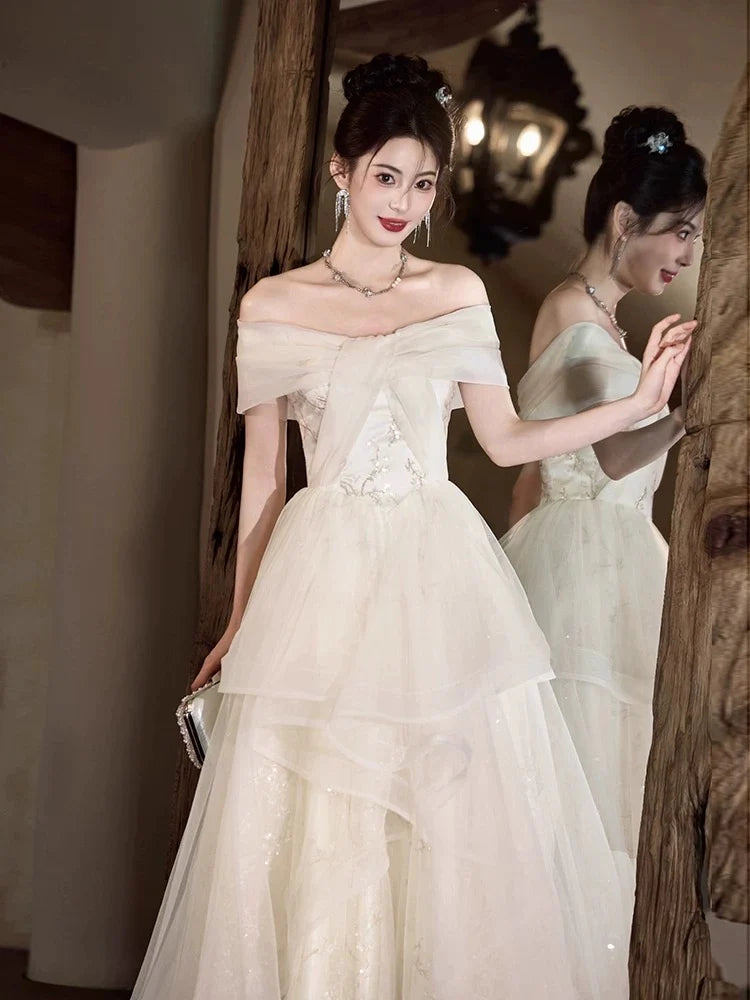 Elegant A-Line Off-the-Shoulder Embellished Ivory Maxi Prom Dress