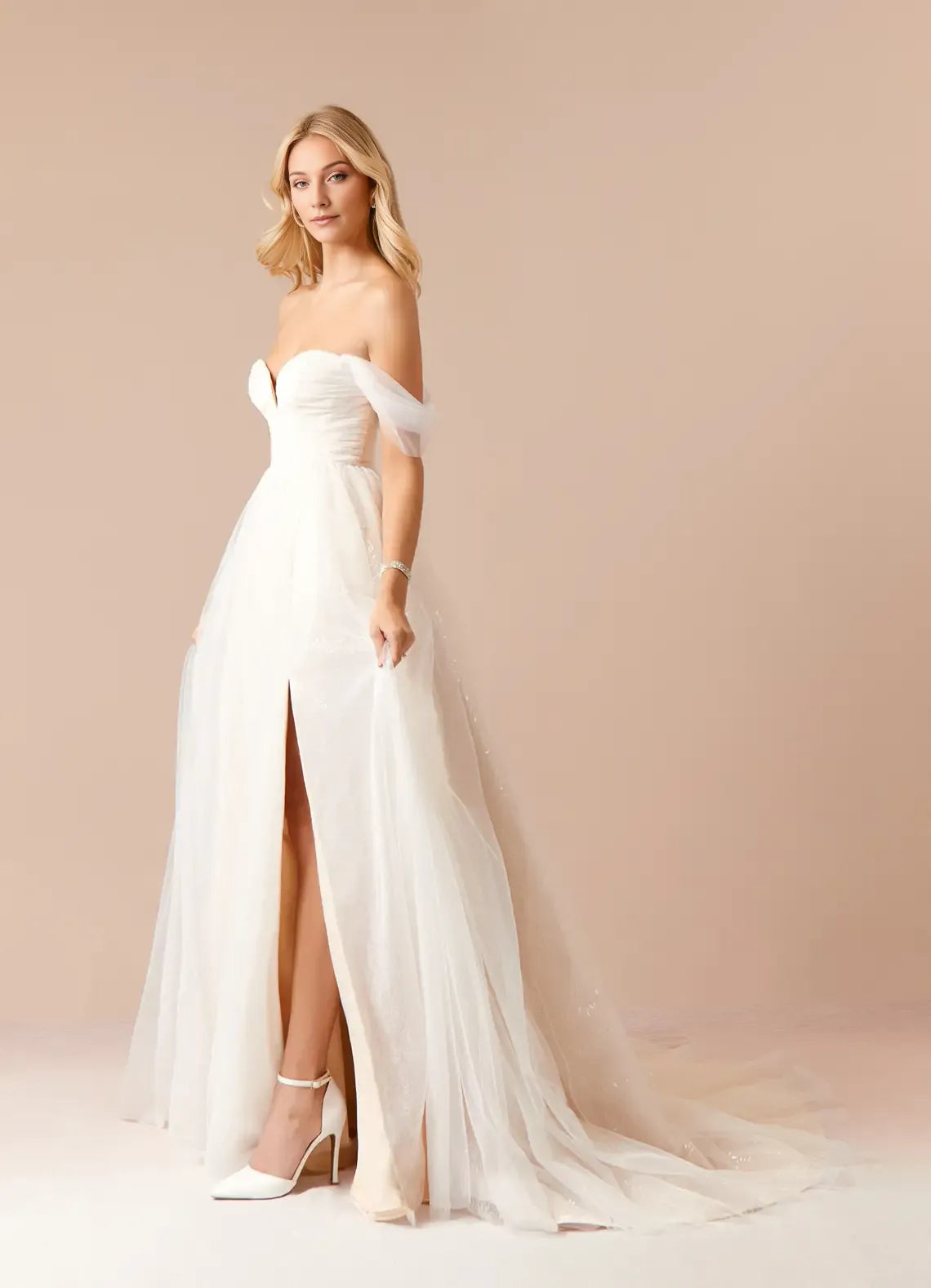 Elegant Champagne A-Line Off the Shoulder Tulle Sweetheart Neckline Wedding Dress with Sheer  Skirt Side Slit, and Sequin Detailing for a Romantic Bridal Look