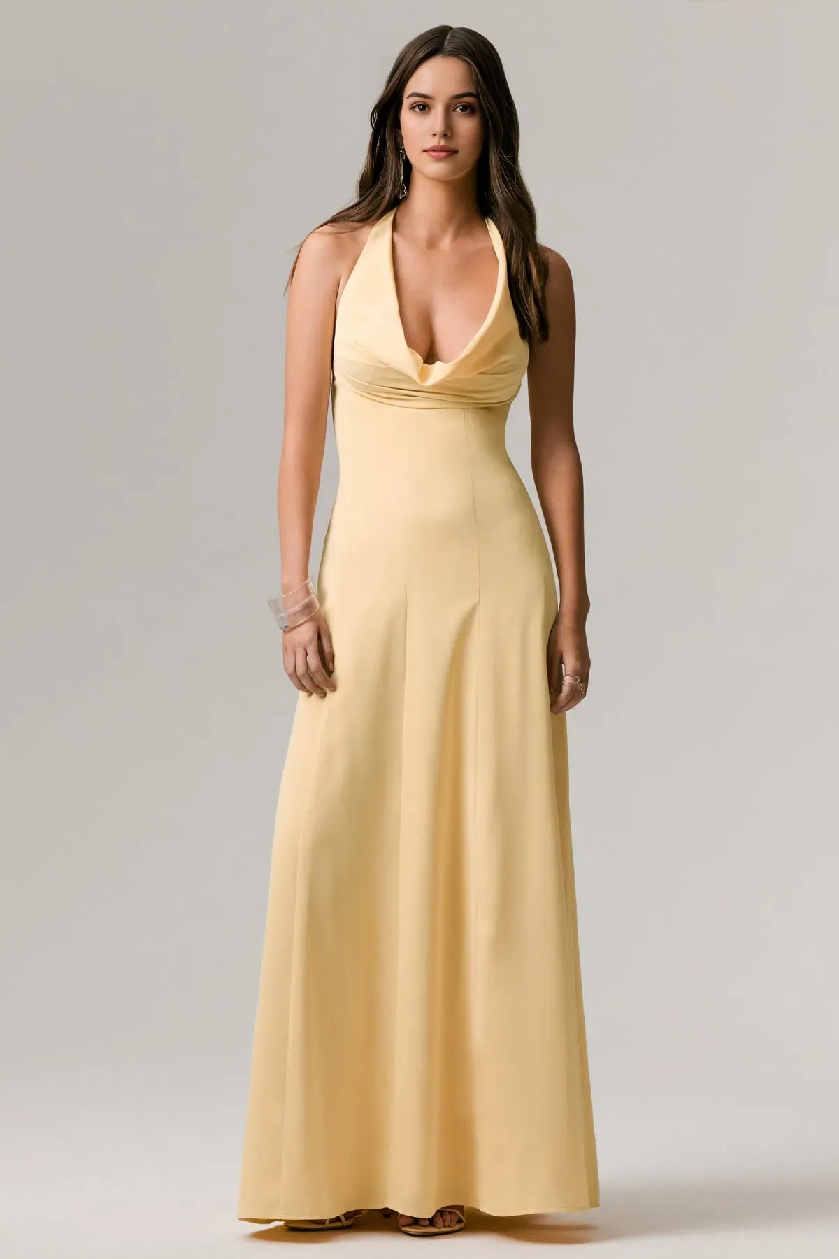 Elegant Halter Neck Prom Dress in Pale Yellow with Cowl Neckline and Flowing Maxi Silhouette
