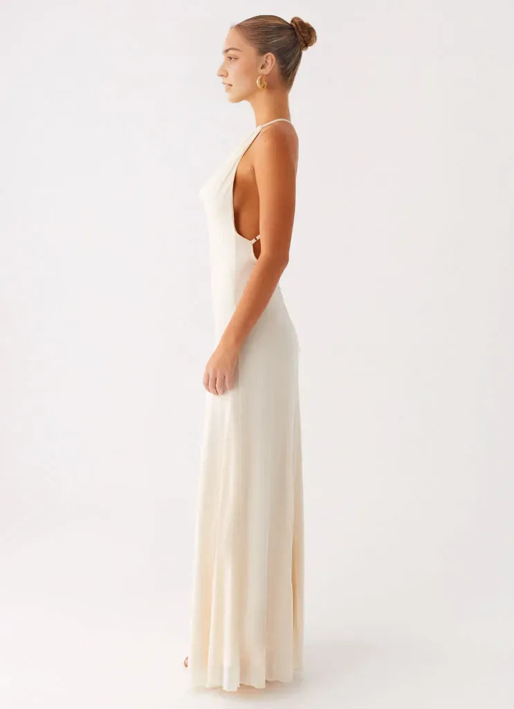 Elegant Ivory Satin Prom Dress with Cowl Neckline Halter Straps Open Back and Floor-Length Silhouette for Formal Occasions