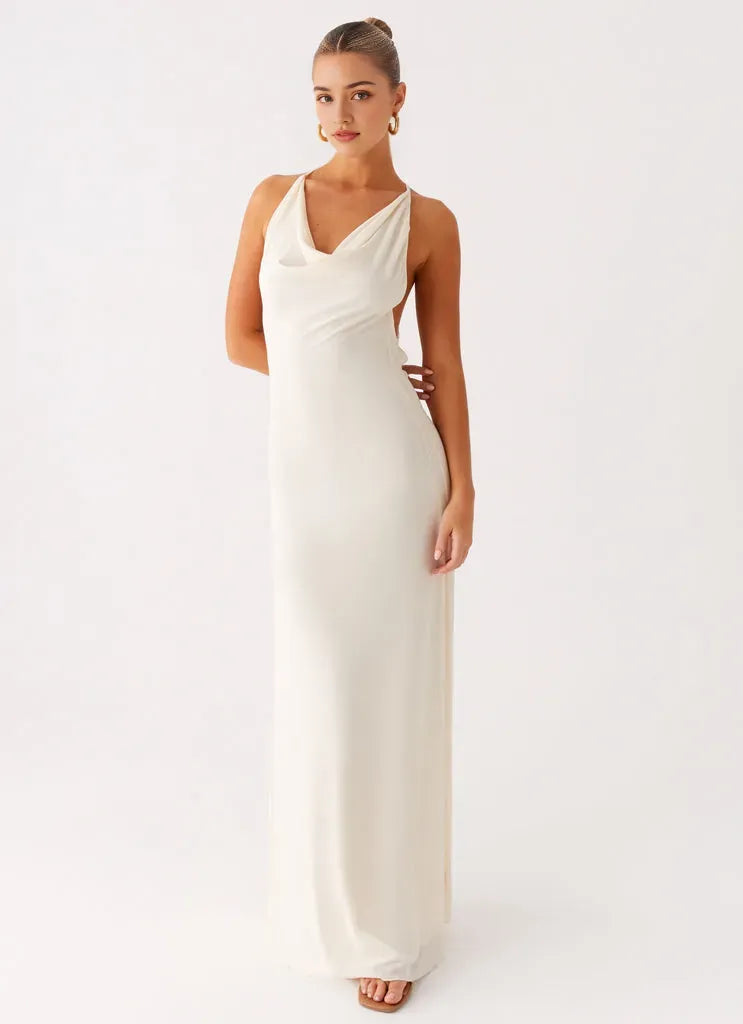 Elegant Ivory Satin Prom Dress with Cowl Neckline Halter Straps Open Back and Floor-Length Silhouette for Formal Occasions
