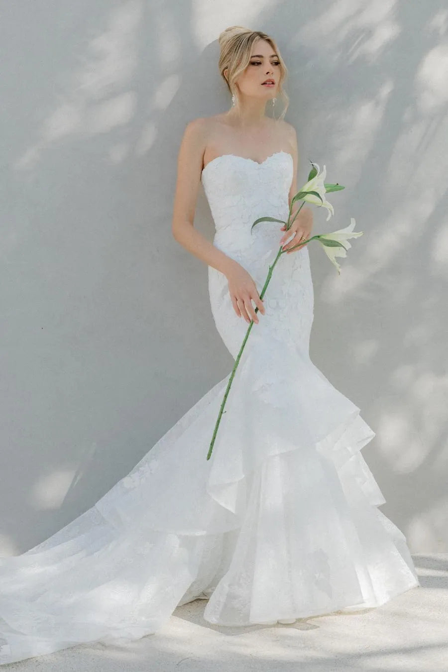 Elegant Mermaid Wedding Dress with Strapless Sweetheart Neckline Floral Lace Tiered Chiffon Train and Fitted Silhouette