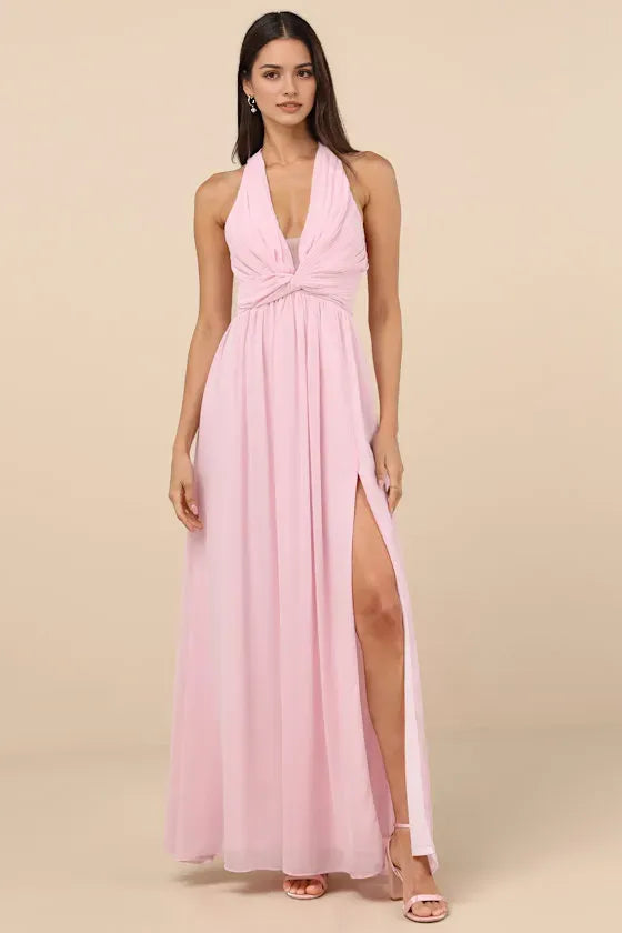 Glamorous Blush Pink Prom Dresses featuring Halter Neckline Twist Front Detail Flowy Chiffon Skirt and High  Slit Design  Perfect for Prom Nights