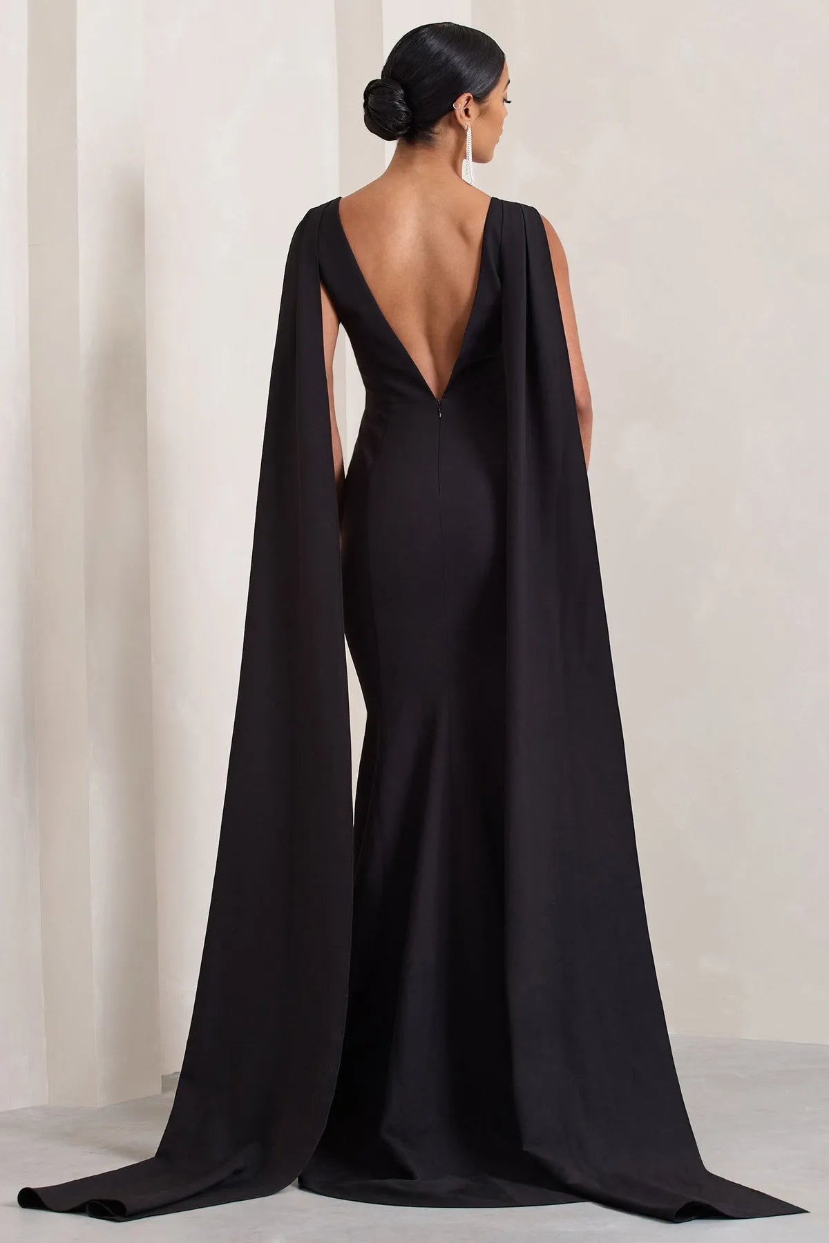 Gorgeous Black Sleeveless Prom Dresses featuring Plunging V - Neck and Striking Cape - Inspired Side Panels Crafted to Dazzle