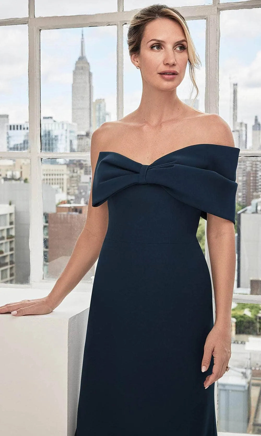 Elegant Navy Blue Strapless Evening Gown with Bow Front Detail Form Fitting Mermaid Silhouette and Structured Bodice for Formal Galas Black Tie Weddings and City Chic Events