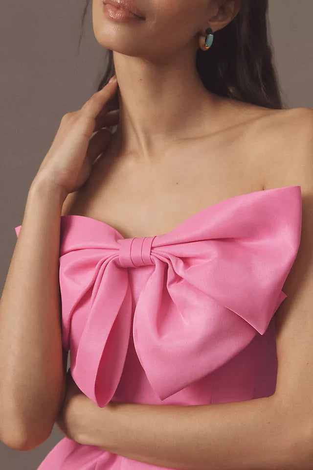 Pink Strapless Homecoming Gown Featuring Bold Bow Embellishment and Flattering Fit Crafted for Fashion  Forward Teens