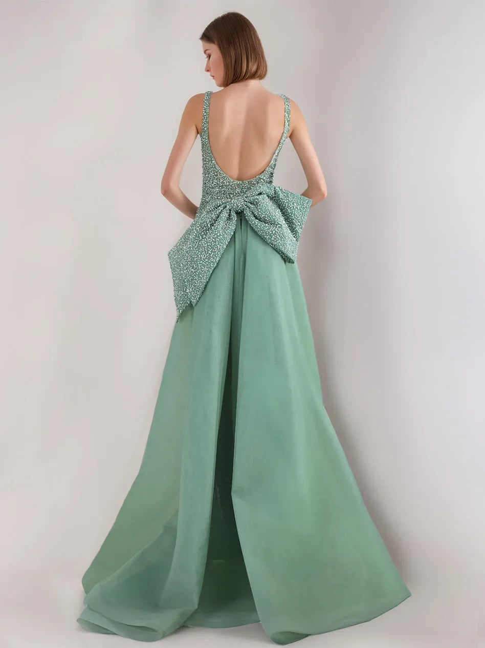 Princess strapless backless sequined evening gown with high waisted bow and sheer