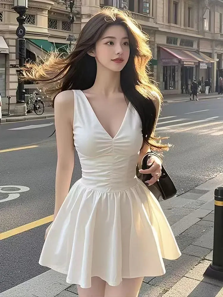 White Sleeveless V - Neck Homecoming Dress with Ruched Bodice Flared Mini Skirt and Timeless Elegance for Memorable School Reunion Occasions