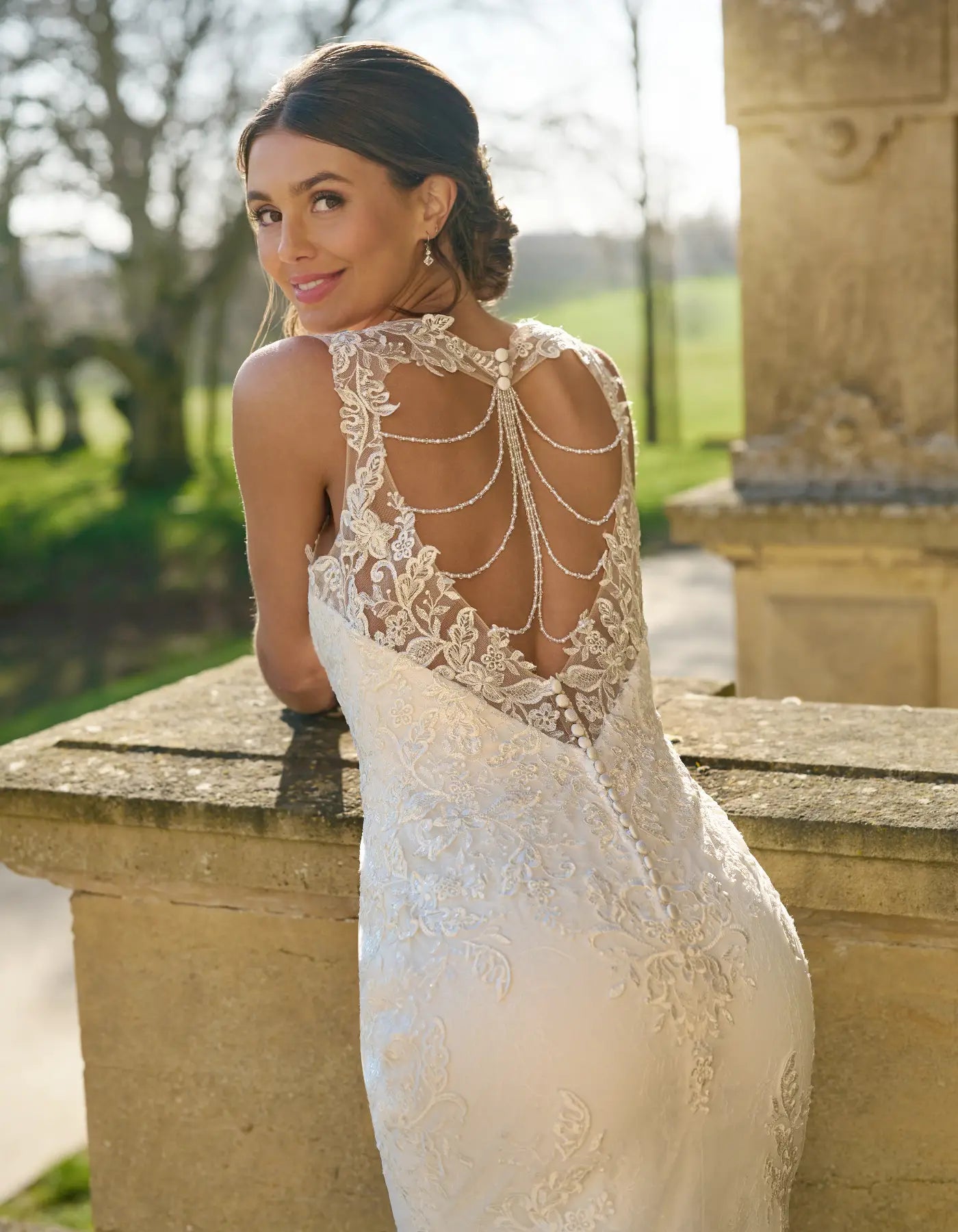 DingJiDress striking sheath with straps and draped beaded back